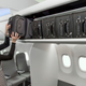 Illustration for article titled Boeings Space Bins Designed To Fit Everyones Annoying Carry-Ons